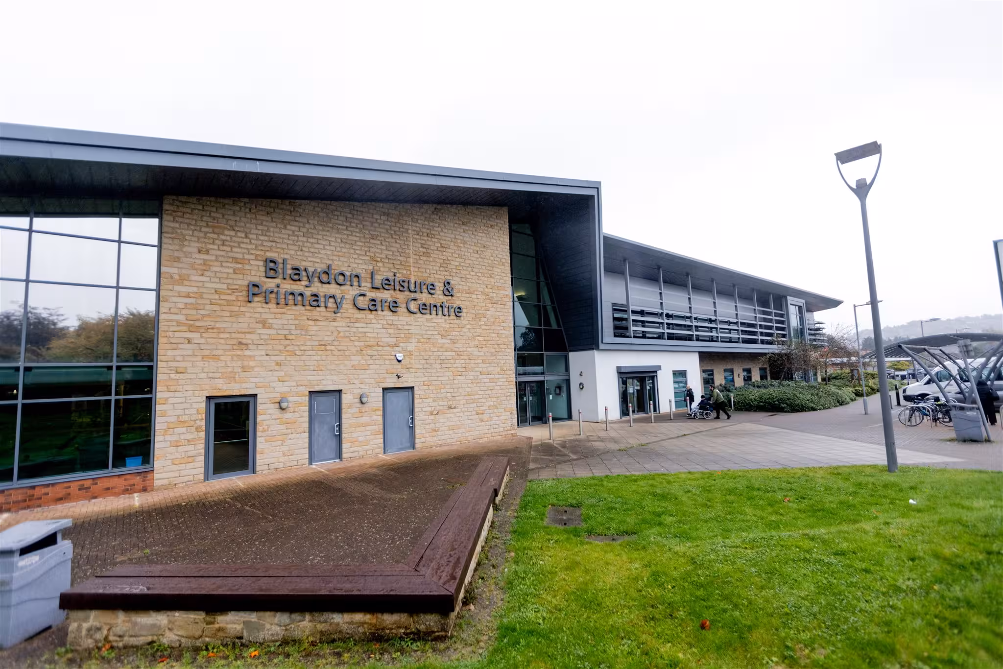 Exterior view of the modern brick and glass building of the Blaydon Leisure & Primary Care Centre.